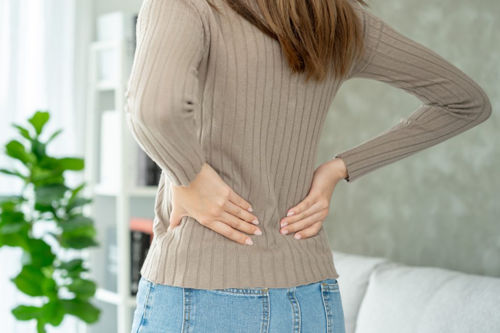 Woman holding lower back
