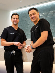 Dr. Branko Skovrlj and Dr. Robert J. Rothrock smiling together at NU‑Spine, board‑certified and fellowship‑trained spine neurosurgeons serving patients in NJ, PA, and FL.