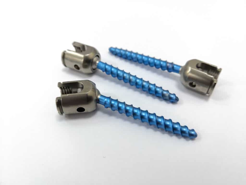 Lumbar pedicle screws with rotating heads on white background