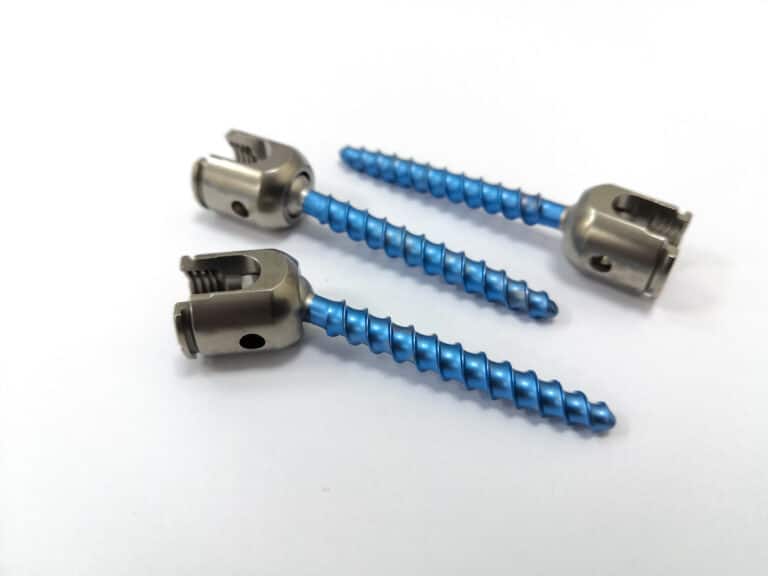 Lumbar pedicle screws with rotating heads on white background