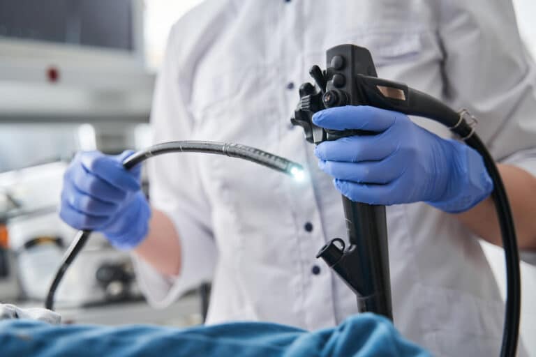 Doctor holding endoscope during surgery