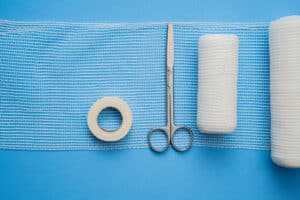 Gauze, tape, and medical scissors for incision care