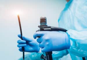 Doctor holding endoscope before surgical procedure